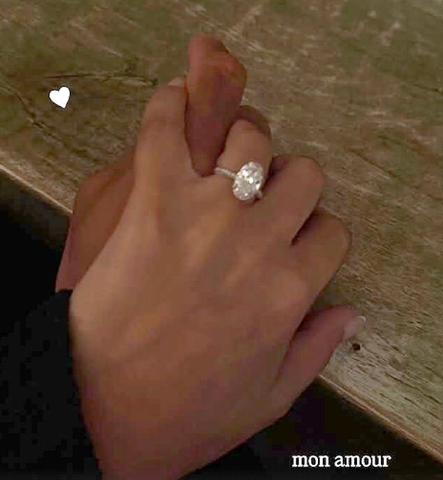 Melanie Lopes shares a close-up of her oval-cut diamond engagement ring with the caption 'Mon amour' on Instagram Stories.
