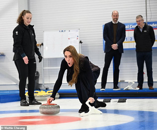 She tentatively took to the 45-metre-long sheet, hoisting her long skirt up and tucking her hair behind her ear to get into position