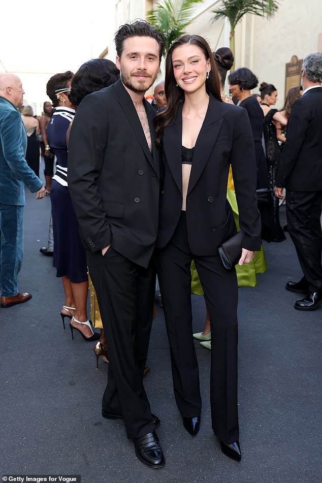 Brooklyn Beckham with wife Nicola Peltz; Afton says he wrote his statement himself.