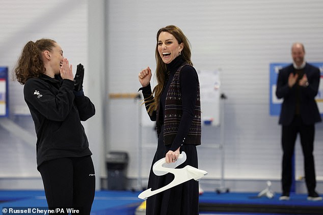 Prince William cheered his wife on in the background as she tried her hand at curling during their visit