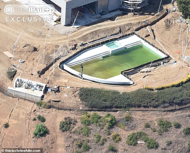 The pool water has turned algae-green as construction continues around Adele's Beverly Park estate.