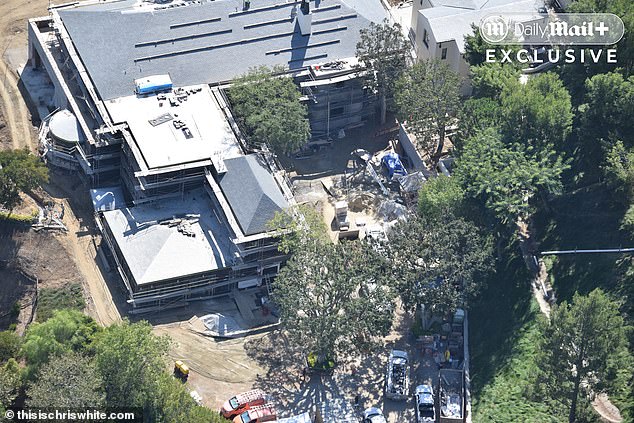 A dozen vehicles and scores of workers swarm the site daily as the rebuild continues.