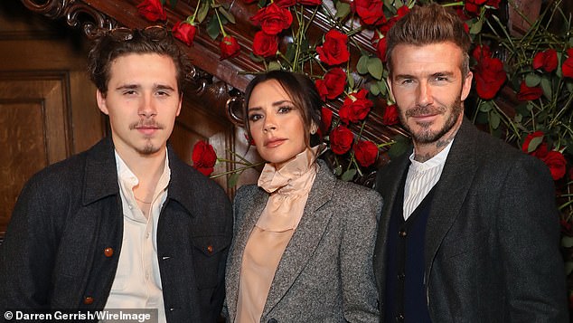 Brooklyn with parents David and Victoria Beckham in 2019, underscoring the family contrast