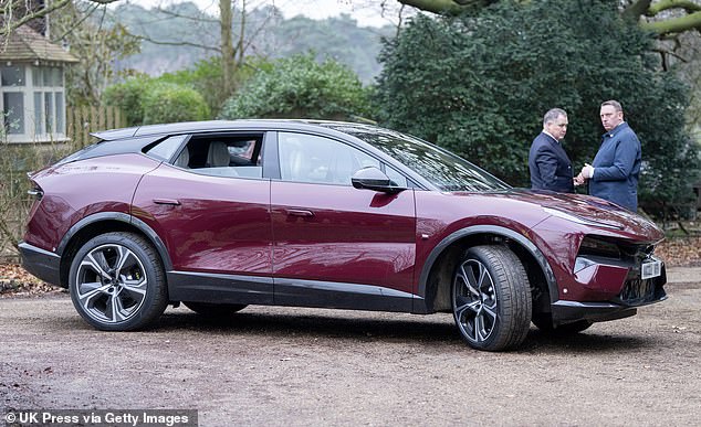King Charles and Queen Camilla arrive in their new Royal Claret Lotus Eletre at Sandringham