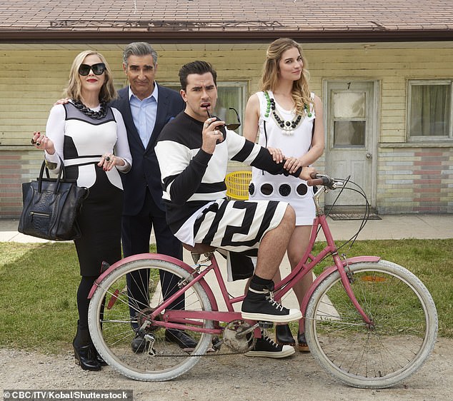 Catherine O'Hara with Eugene Levy, Daniel Levy, and Annie Murphy in a Schitt's Creek promo image