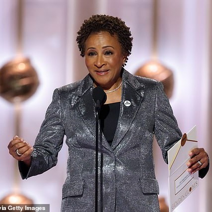 The host Wanda Sykes (pictured) - who used one of her speeches at the Los Angeles show to mock Maher - also donned the badge on the lapel of her glittery silver suit - DailyMailUS
