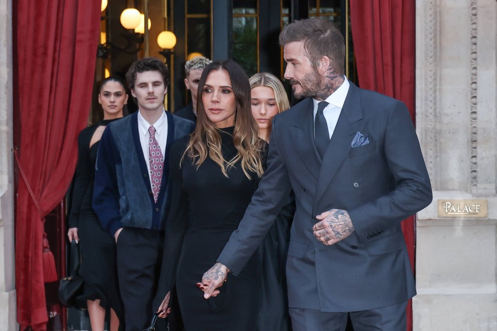 The Beckham family, including David and Victoria, leaving their hotel during Paris Fashion Week.