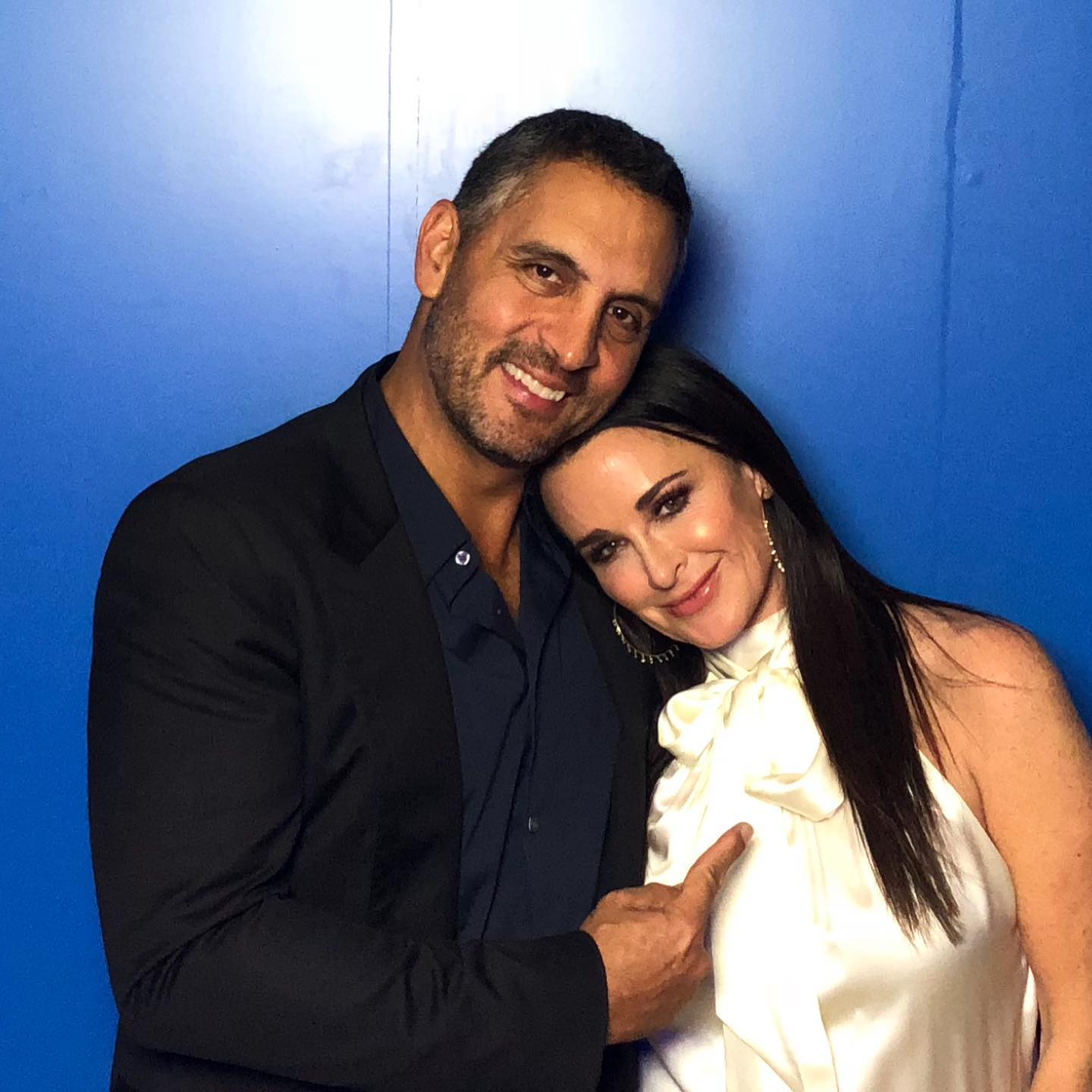 Kyle Richards and Mauricio Umansky smiling together in a past photo.