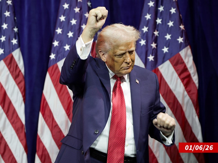 Close-up of Trump mid-dance with clenched fists at a rally-style event.