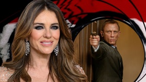 Elizabeth Hurley in a white two-piece with Bond girl vibes (Getty Images)