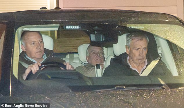 Andrew Mountbatten-Windsor gradually sinks lower in his seat in a bid to avoid photographers