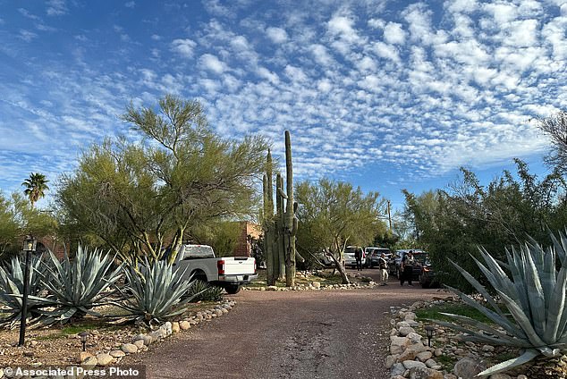 Law enforcement officers outside Nancy Guthrie's home near Tucson.