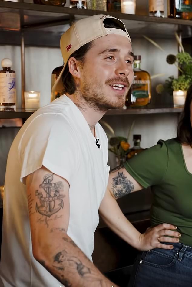 Brooklyn Beckham shows the anchor tattoo that once featured the word dad