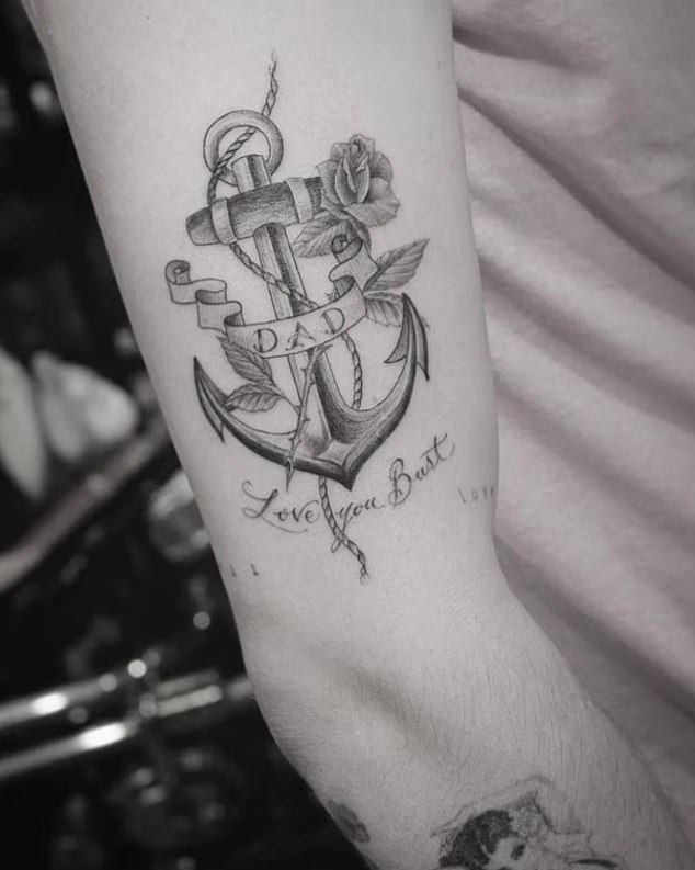 Close-up of Brooklyn Beckham's anchor tattoo before the cover-up of dad lettering