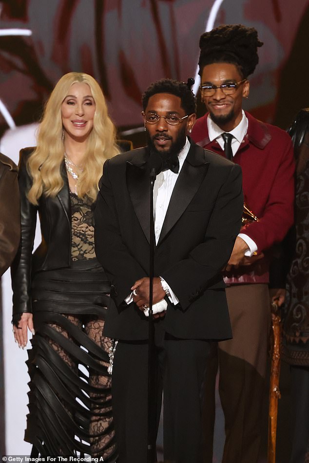 Cher laughs and corrects herself to announce Kendrick Lamar as Record of the Year winner for "Luther"