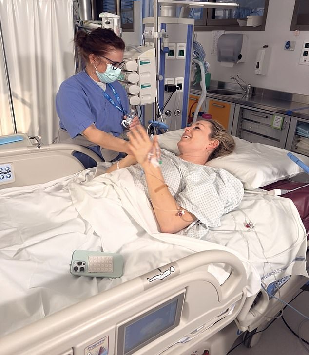 Lindsey Vonn speaks with a nurse in her hospital room following surgery