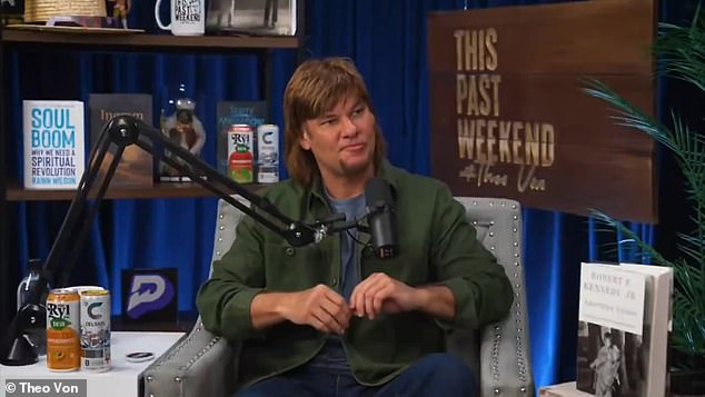 Theo Von, host of "This Past Weekend," speaking into a podcast microphone.