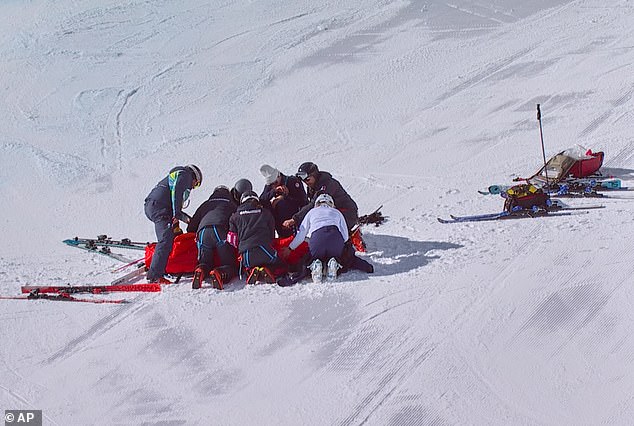 Medical crews attend to Lindsey Vonn on the piste after her crash