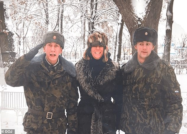 Ghislaine Maxwell with two men in military-style uniforms