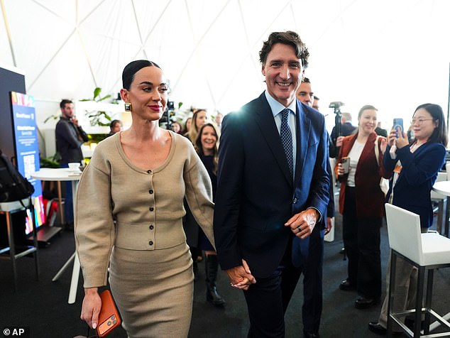Justin Trudeau and Katy Perry leave an event at the World Economic Forum in Davos