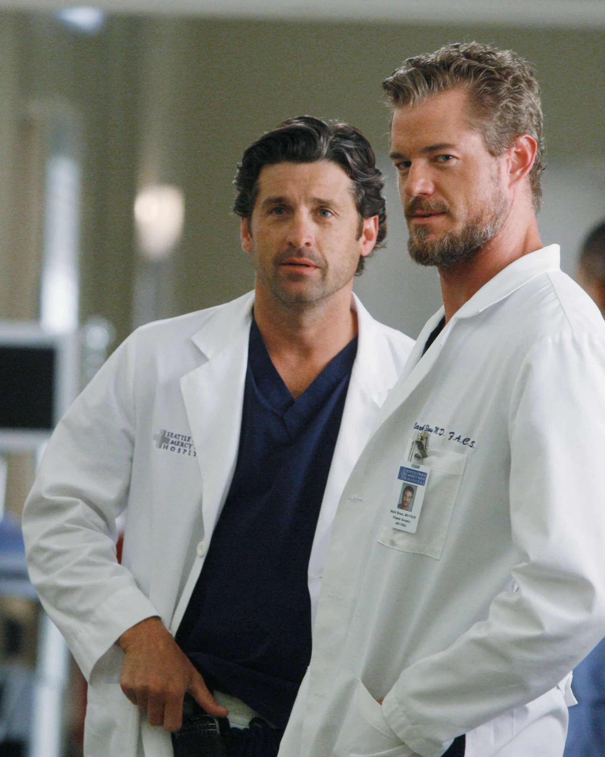 Patrick Dempsey and Eric Dane portraying Dr. Derek Shepherd and Dr. Mark Sloan, respectively, from the TV series Grey's Anatomy.