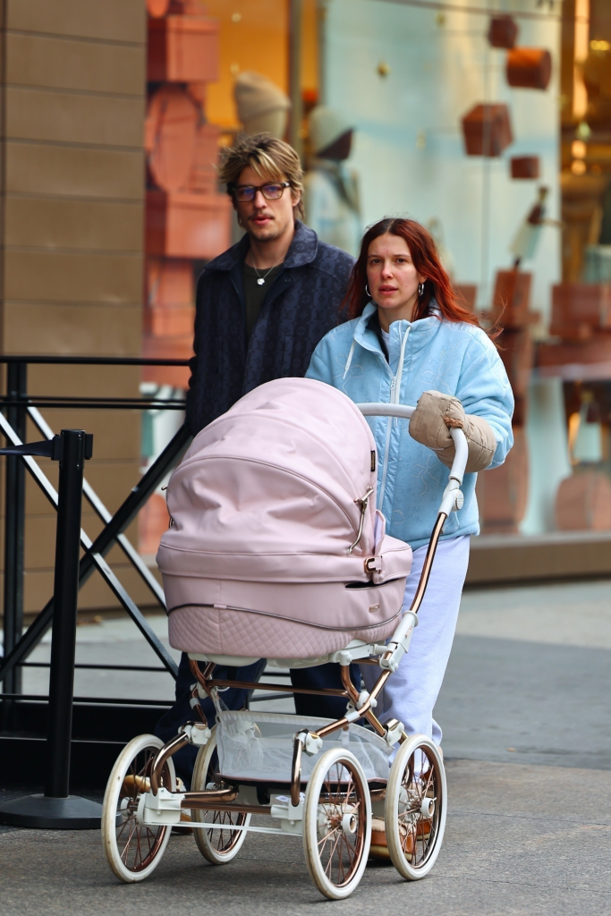 Millie Bobby Brown and Jake Bongiovi walk in New York City with a pink stroller.