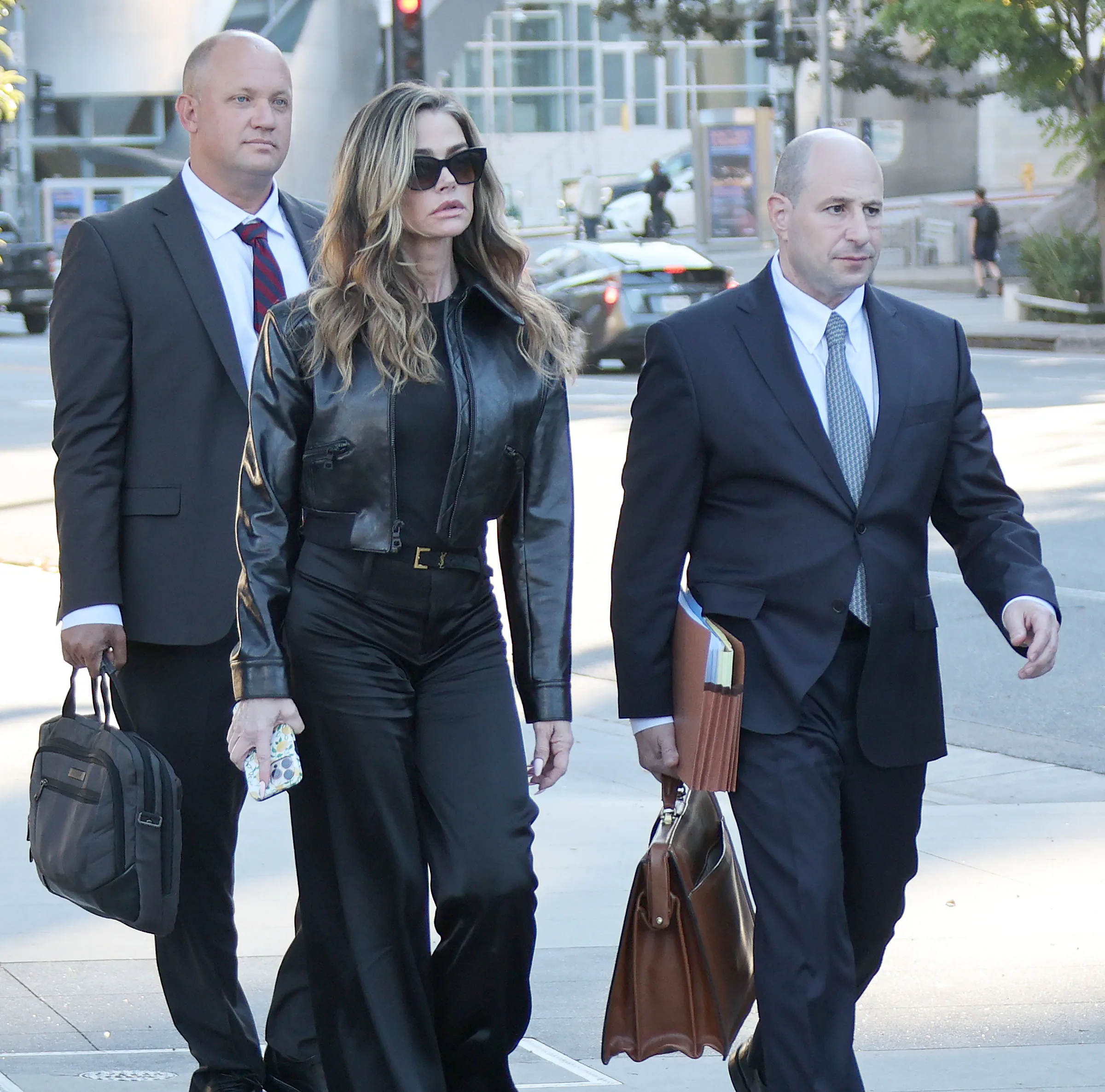 Denise Richards leaving the Los Angeles Superior Courthouse with her attorneys.