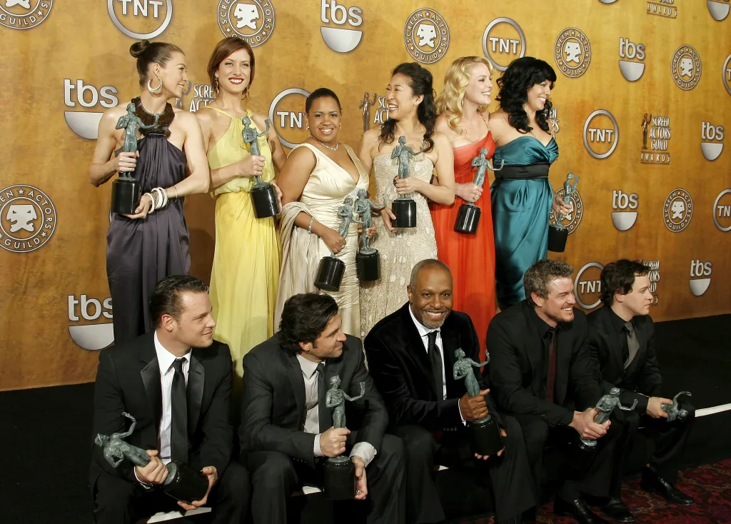 Cast members of Grey's Anatomy, including Ellen Pompeo, Kate Walsh, Chandra Wilson, Sandra Oh, Katherine Heigl, Sara Ramirez, Justin Chambers, Patrick Dempsey, James Pickens Jr., Eric Dane, and T.R. Knight, hold their "Ensemble In A Drama Series" Screen Actors Guild Awards.