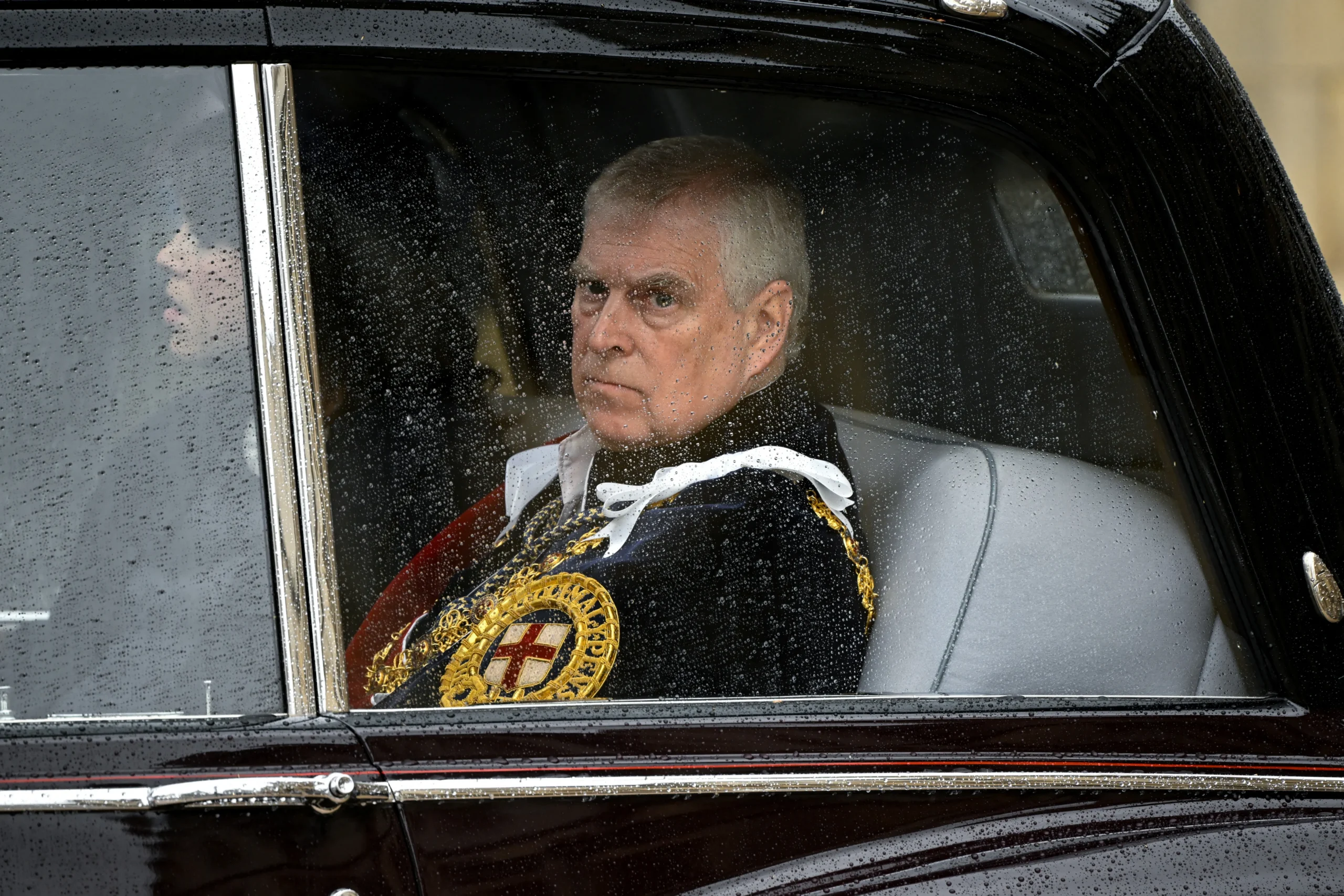 Prince Andrew in military uniform leaves Westminster Abbey.