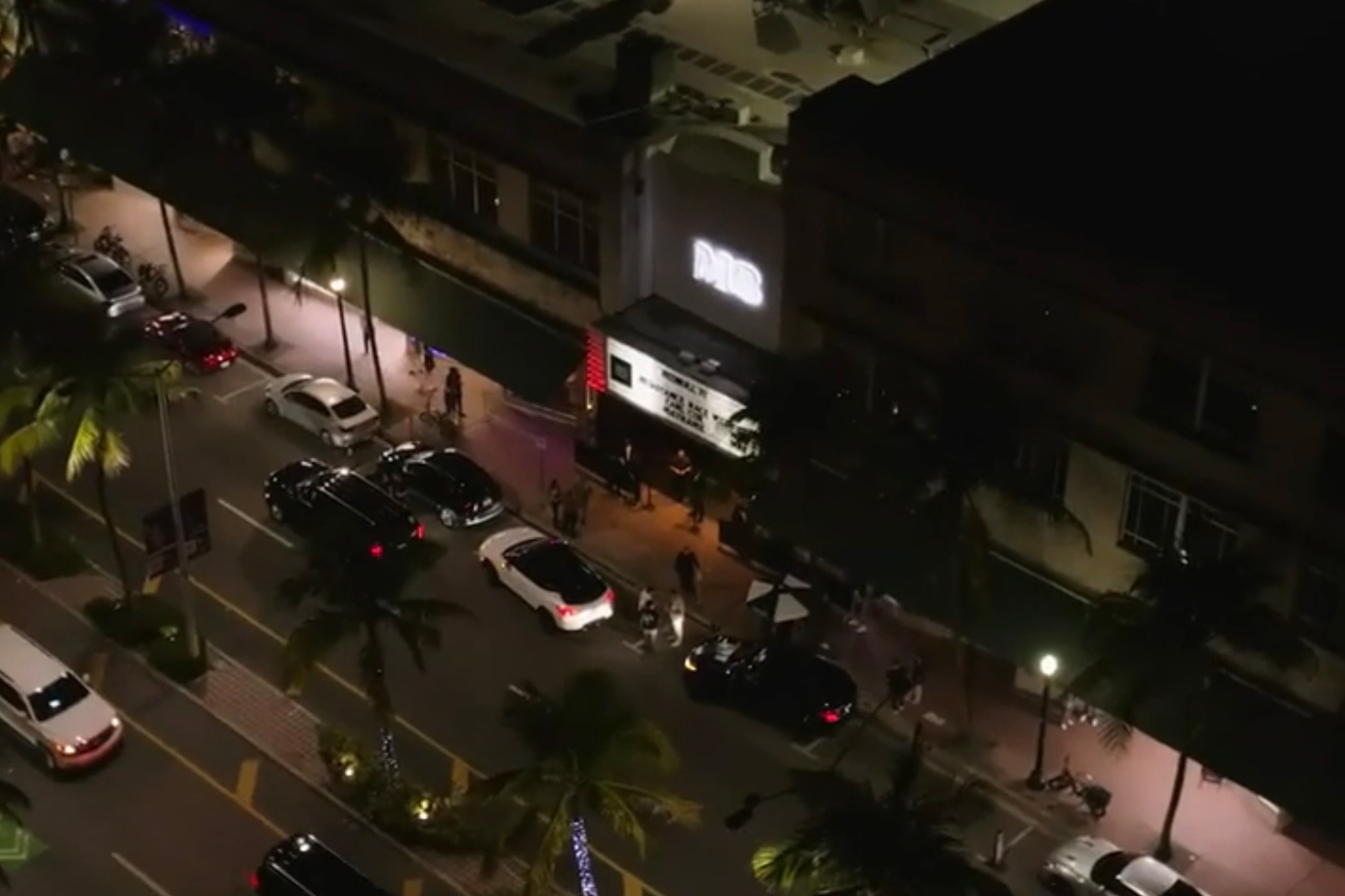 Exterior of Miami's M2 nightclub at night during Race Week, with cars lining the street.