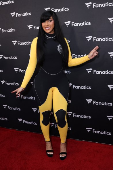 Cardi B in a black-and-yellow Chrome Hearts scuba suit on the Fanatics Super Bowl party red carpet.