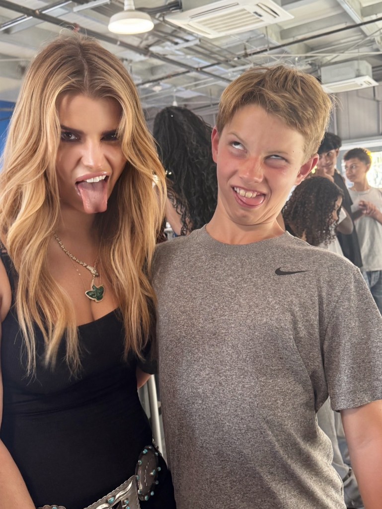 Jessica Simpson and her son Ace sticking out their tongues and making funny faces.