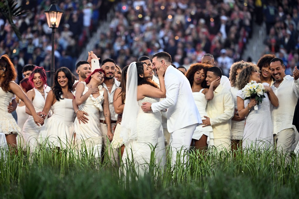 Bride and groom share a kiss during Bad Bunny's Apple Music Super Bowl LX Halftime Show wedding.