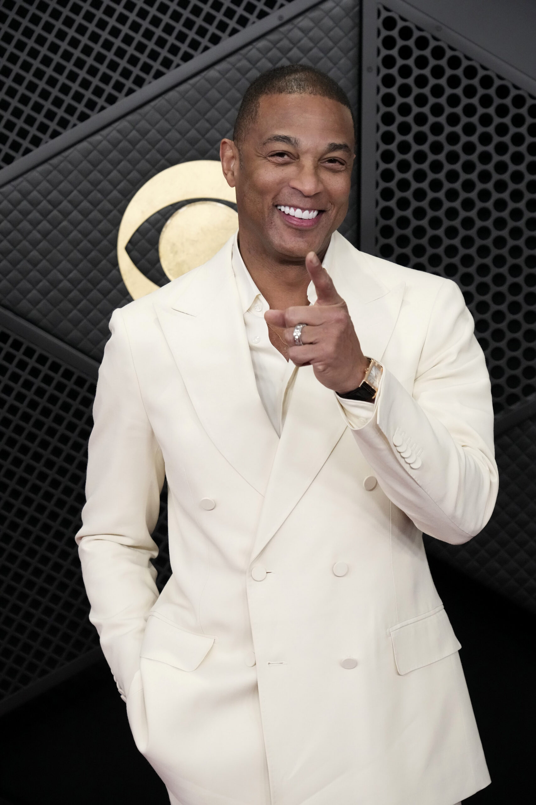 Don Lemon smiling and pointing at the 68th GRAMMY Awards.