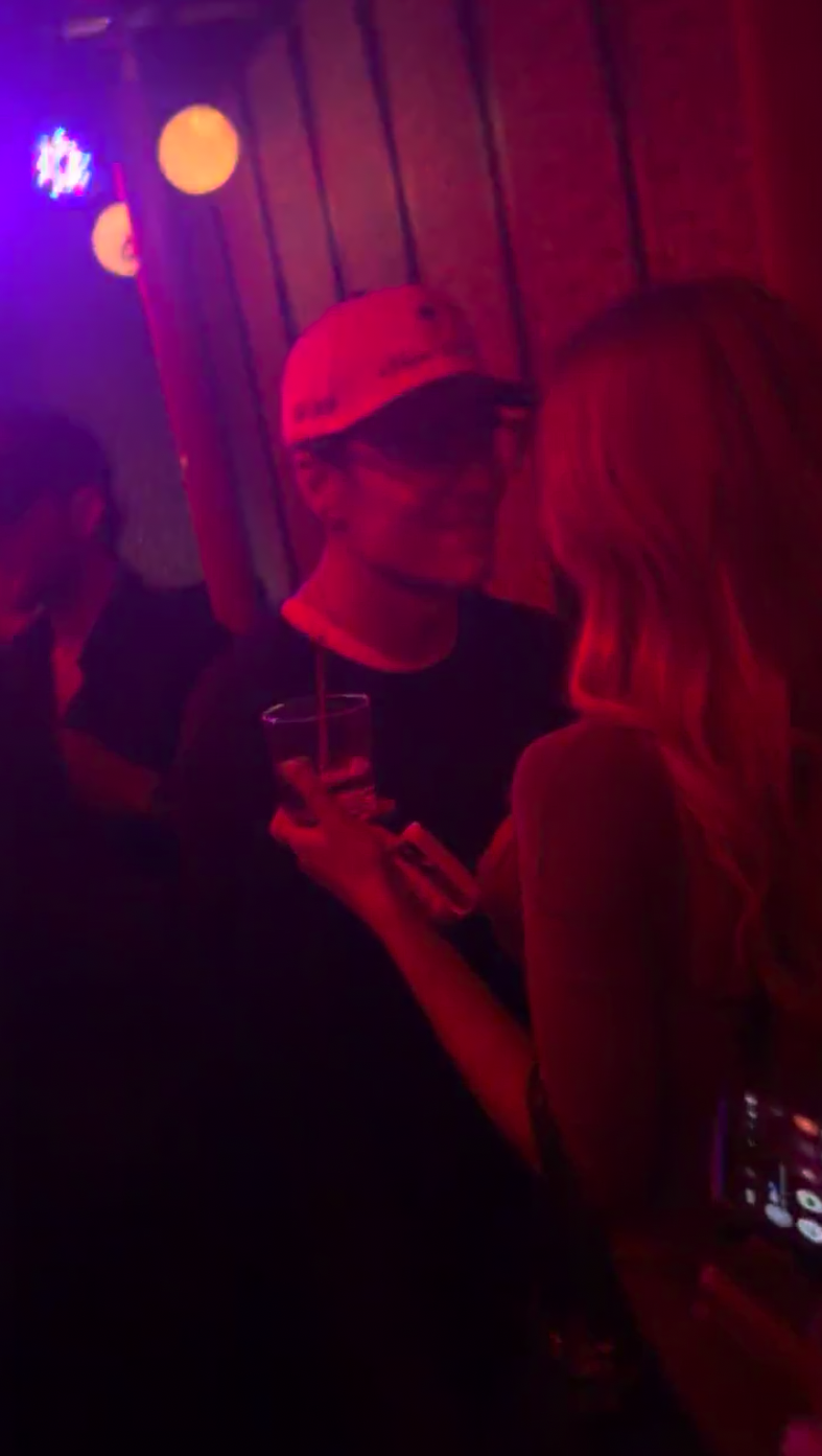 Tom Brady with his arm around Alix Earle at a Super Bowl party.