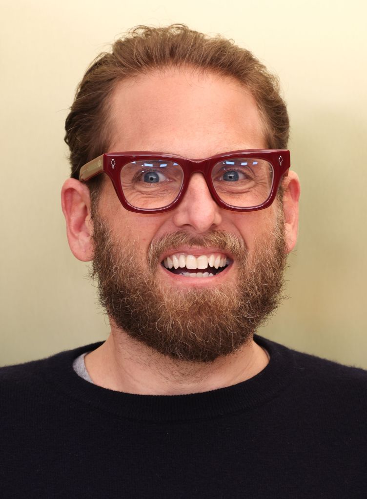 Jonah Hill smiling on set.