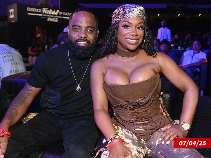 Kandi Burruss and Todd Tucker posing together