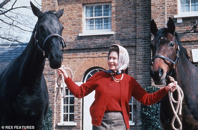 Queen Elizabeth II with two horses at Sandringham Estate in Norfolk