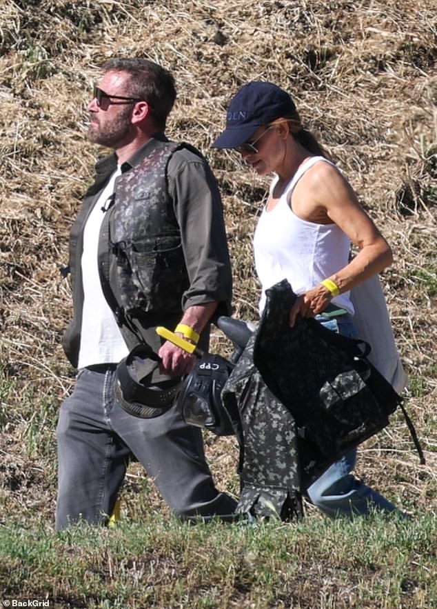 Jennifer Garner and Ben Affleck in paint-splattered gear at a California paintball park for son Samuel's birthday.