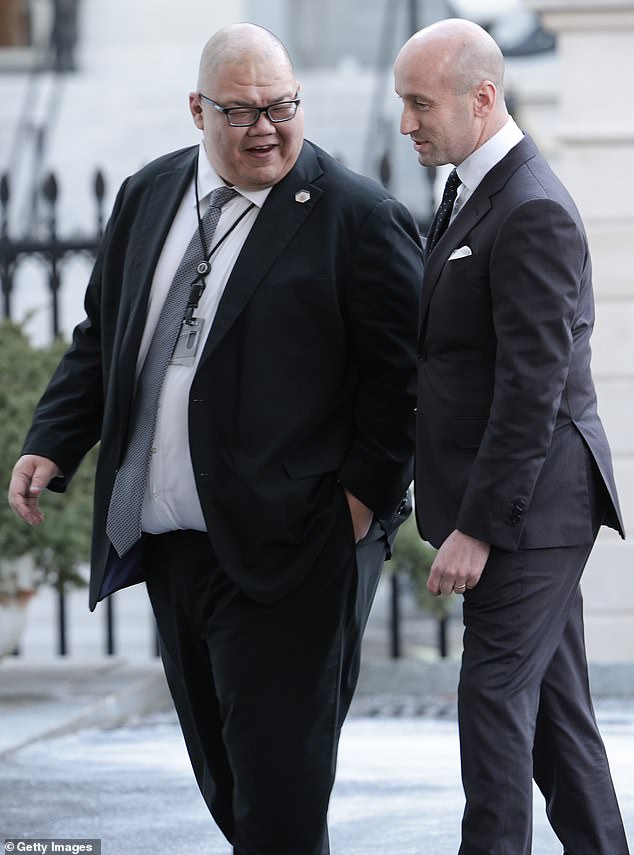 Stephen Miller (R), Deputy White House Chief of Staff for Policy, walks into the White House with Steven Cheung, White House Communications Director on January 28, 2025 in Washington, DC