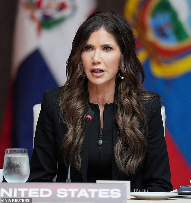 Kristi Noem speaks at a podium during an official event