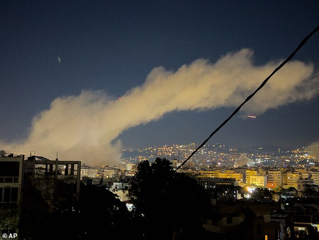 Smoke rises over Beirut's southern suburb of Dahiyeh after Israeli airstrikes, as civilians in nearby Lebanese villages were urged to evacuate.
