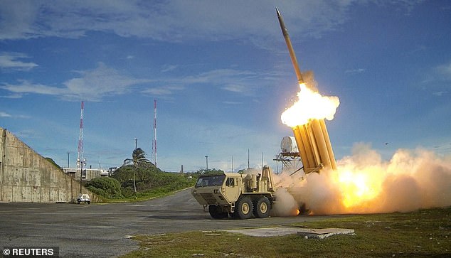 A U.S. THAAD anti-missile system during a launch, highlighting concerns about missile-defense stockpiles in a prolonged conflict.