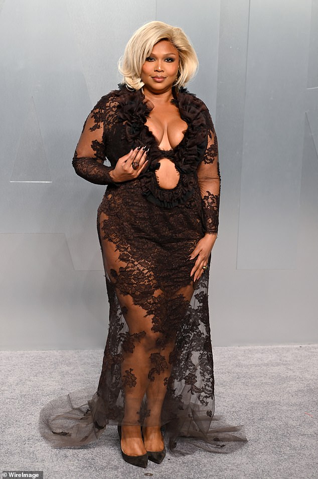 Lizzo in a dramatic sheer lace gown at the Vanity Fair party
