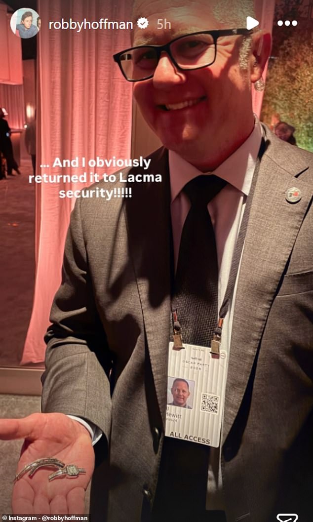 LACMA security holds the found watch after Robby Hoffman turned it in