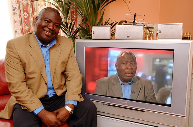 Guy Goma seated beside a TV showing his unexpected BBC interview