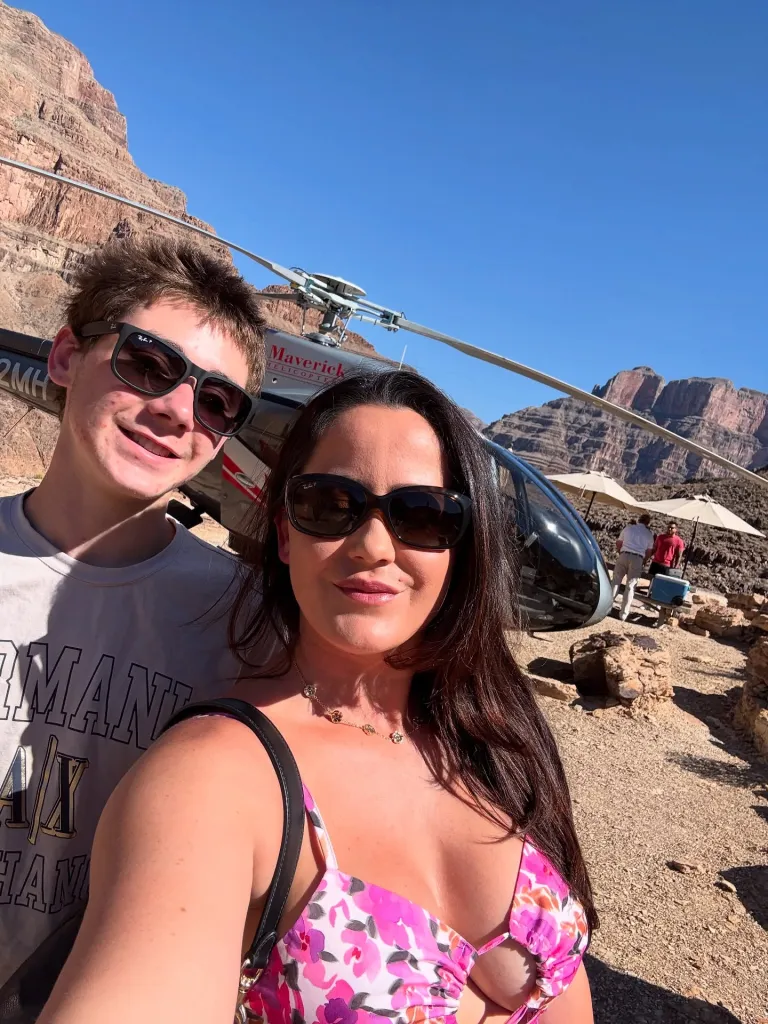 Jenelle Evans and her son Jace taking a selfie in front of a helicopter.