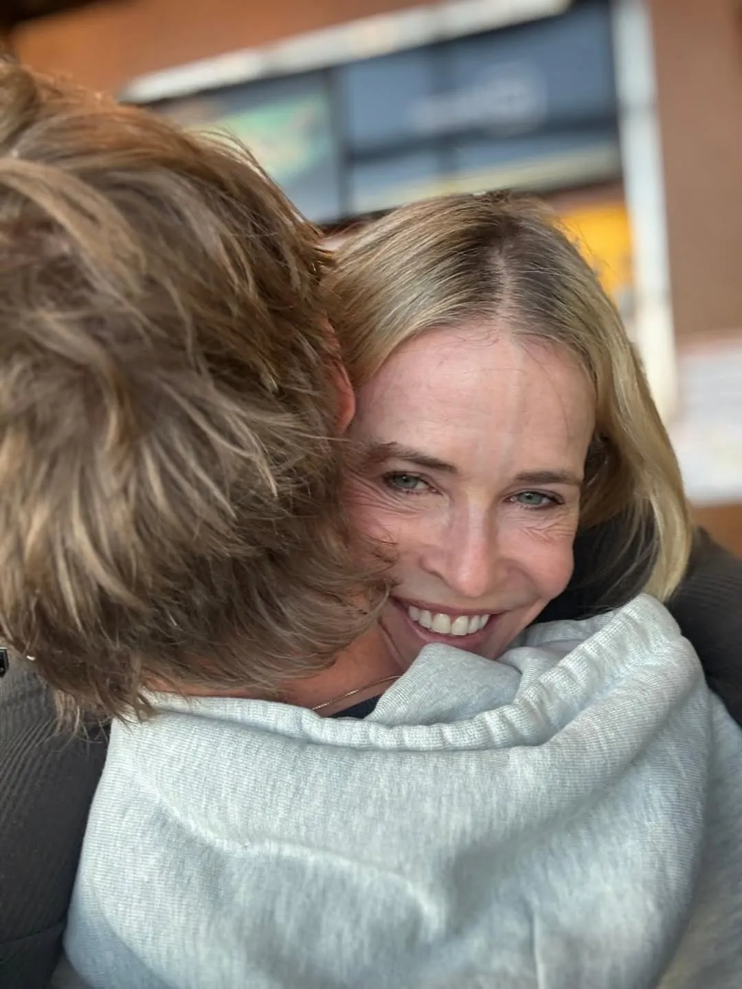 Chelsea Handler smiles while hugging a man during her Arctic birthday trip.