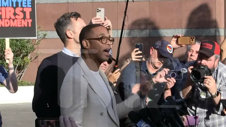Don Lemon speaking to a crowd at a protest rally