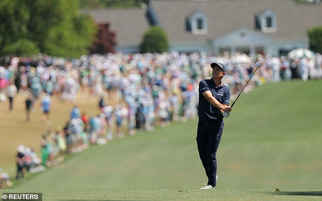 Justin Rose plays his approach on the 1st hole during the Masters final round at Augusta National.